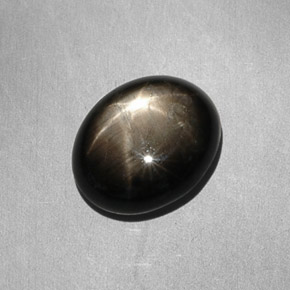 Safira estrela preto natural 7,90ct, corte oval, opaco