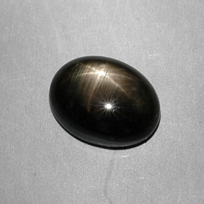 Safira estrela preto natural 7,49ct, corte oval, opaco
