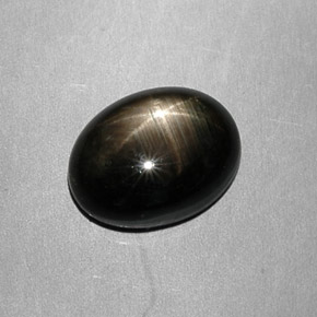 Safira estrela preto natural 7,49ct, corte oval, opaco
