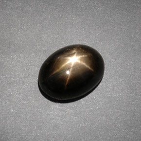 Safira estrela preto natural 4,30ct, corte oval, opaco