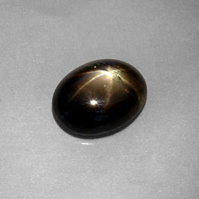Safira estrela preto natural 1,80ct, corte oval, translúcido