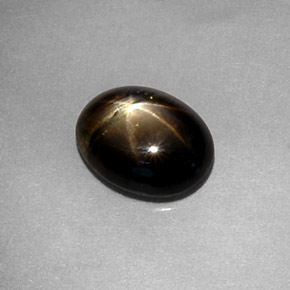 Safira estrela preto natural 1,80ct, corte oval, translúcido
