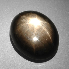 Safira estrela preto natural 7,90ct, corte oval, opaco