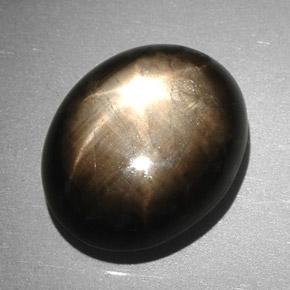 Safira estrela preto natural 7,90ct, corte oval, opaco
