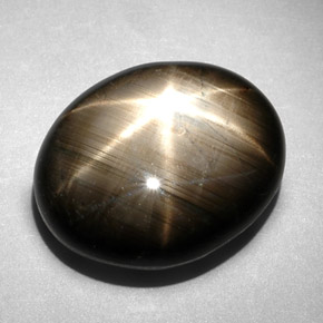Safira estrela preto natural 10,83ct, corte oval, opaco