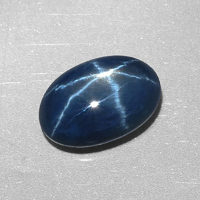 Safira estrela azul natural 2,55ct, corte oval, opaco