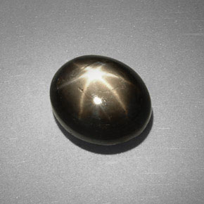 Safira estrela preto natural 6,38ct, corte oval, opaco