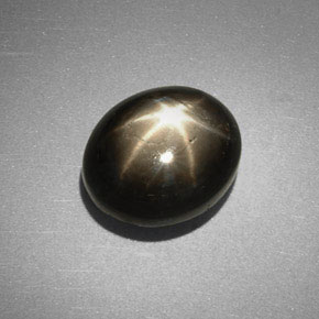 Safira estrela preto natural 6,38ct, corte oval, opaco