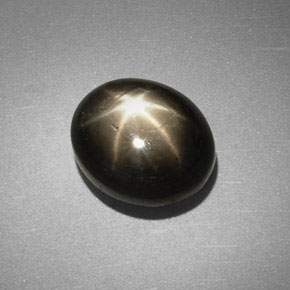 Safira estrela preto natural 6,38ct, corte oval, opaco