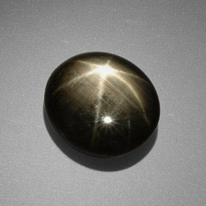 Safira estrela preto natural 9,85ct, corte oval, opaco