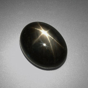 Safira estrela preto natural 9,38ct, corte oval, opaco
