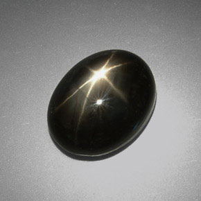 Safira estrela preto natural 9,38ct, corte oval, opaco