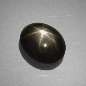 Safira estrela preto natural 5,63ct, corte oval, opaco
