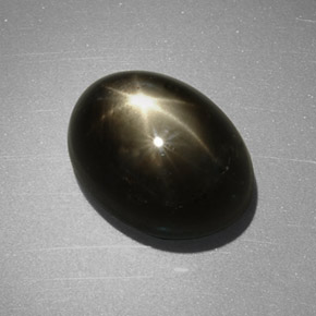 Safira estrela preto natural 7,55ct, corte oval, opaco