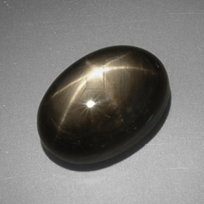 Safira estrela preto natural 7,78ct, corte oval, opaco