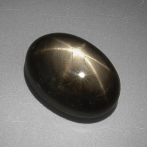 Safira estrela preto natural 7,78ct, corte oval, opaco