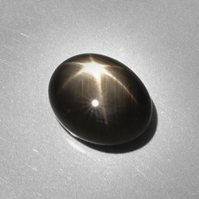Safira estrela preto natural 6,28ct, corte oval, opaco