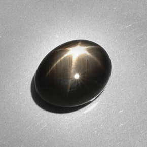 Safira estrela preto natural 6,28ct, corte oval, opaco