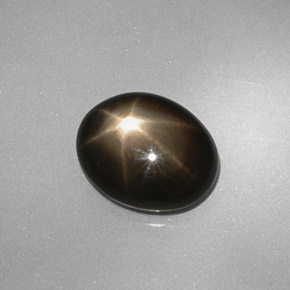 Safira estrela preto natural 4,38ct, corte oval, opaco