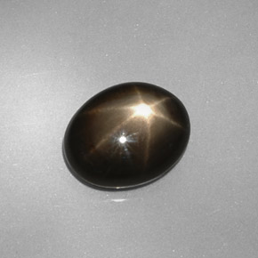 Safira estrela preto natural 4,38ct, corte oval, opaco