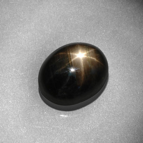 Safira estrela preto natural 8,13ct, corte oval, opaco