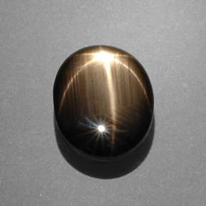 Safira estrela preto natural 7,53ct, corte oval, opaco