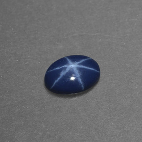 Safira estrela azul natural 0,46ct, corte oval, opaco