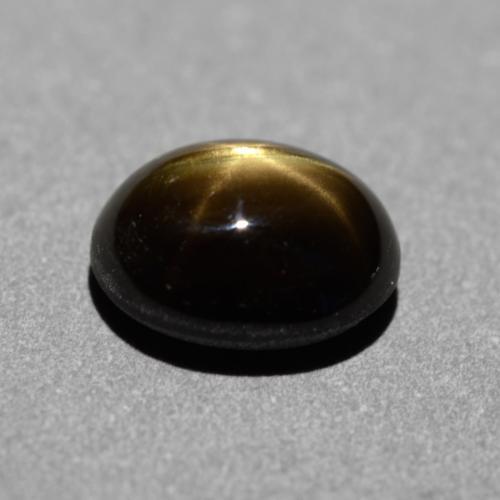 Safira estrela preto natural 1,31ct, corte oval, opaco