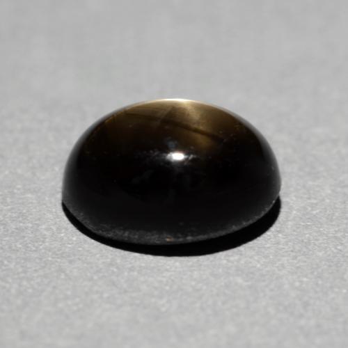 Safira estrela preto natural 1,49ct, corte oval, opaco