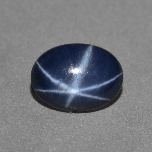 Safira estrela azul natural 0,97ct, corte oval, opaco