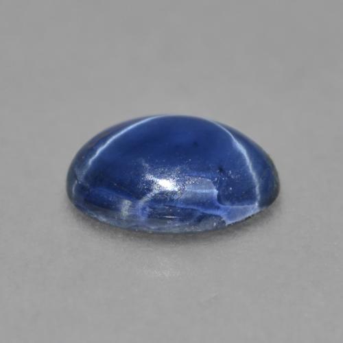 Safira estrela azul natural 0,99ct, corte oval, opaco