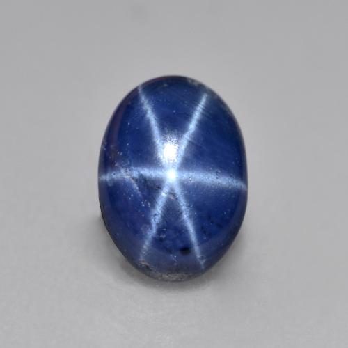 Safira estrela azul natural 0,99ct, corte oval, opaco