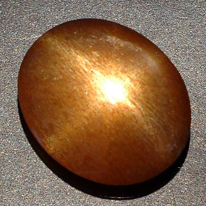 Pedra do sol estrela marrom natural 8,09ct, corte oval, opaco