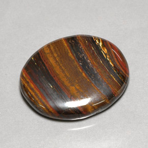 Tiger's eye matrix multicolorido natural 53,09ct, corte oval, opaco