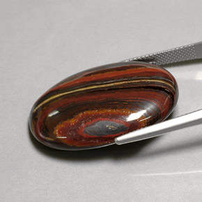 Tiger's eye matrix multicolorido natural 45,58ct, corte oval, opaco
