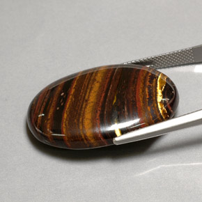 Tiger's eye matrix multicolorido natural 43,53ct, corte oval, opaco