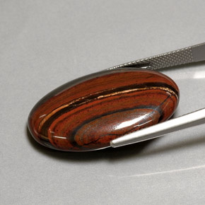 Tiger's eye matrix multicolorido natural 35,01ct, corte oval, opaco