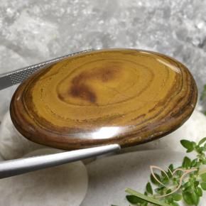 Olho de Tigre Castanho médio-escuro Natural 79.99ct, oval, Opaco