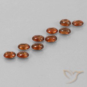 Pedras preciosas de Zircão Castanho Canela Profundo natural de 7.73 ct, oval, Transparente