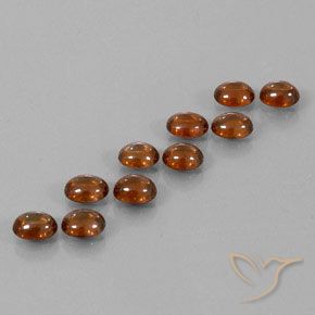 Pedras preciosas de Zircão Laranja escuro natural de 10.23 ct, oval, Transparente