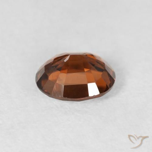 Zircão Laranja Marrom Profundo Natural 0.99ct, oval, VS